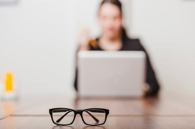 Glasses of office working woman