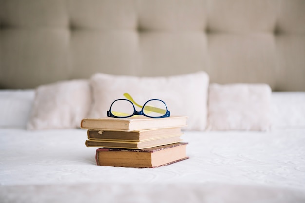 Free photo glasses on old books