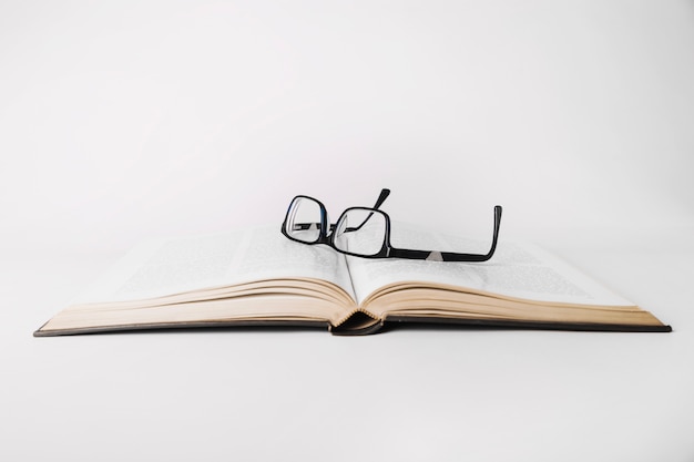 Glasses on opened book