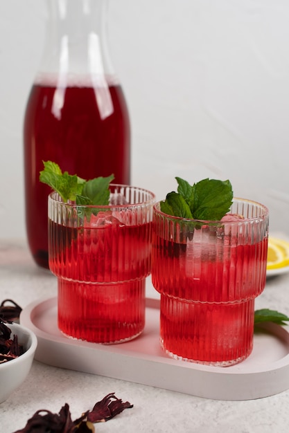 Free photo glasses of refreshing hibiscus ice tea