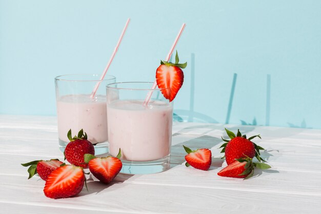 Glasses of strawberry yogurt with berries