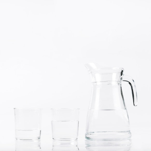 Glasses of water and jar