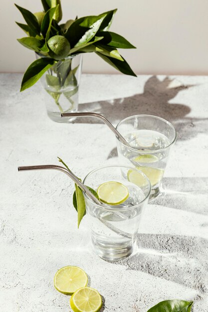 Glasses of water with lemon slices on table