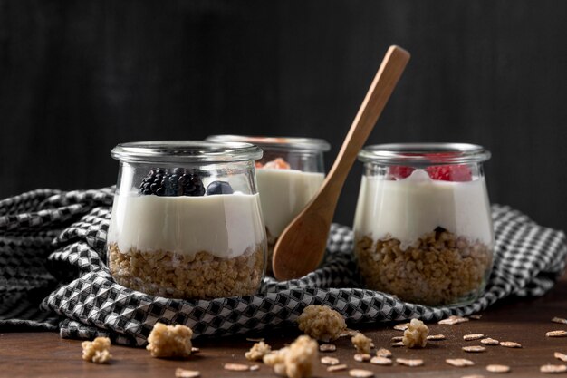 Glasses with cereal and yougurt on table