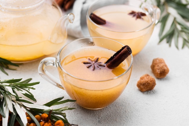 Glasses with flavored cinnamon juice on table