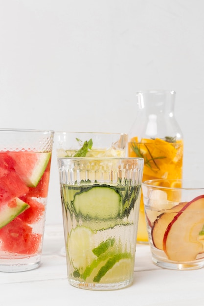 Glasses with fresh fruits drinks