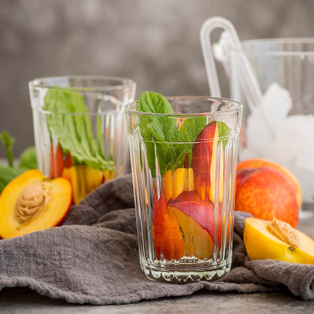 Glasses with ice tea with mint and peach