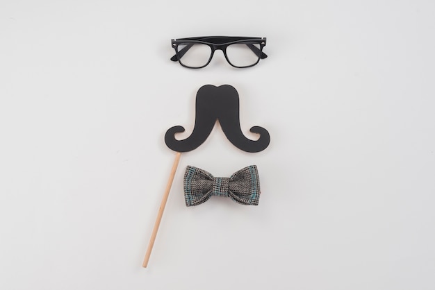 Free photo glasses with paper mustache and bow tie