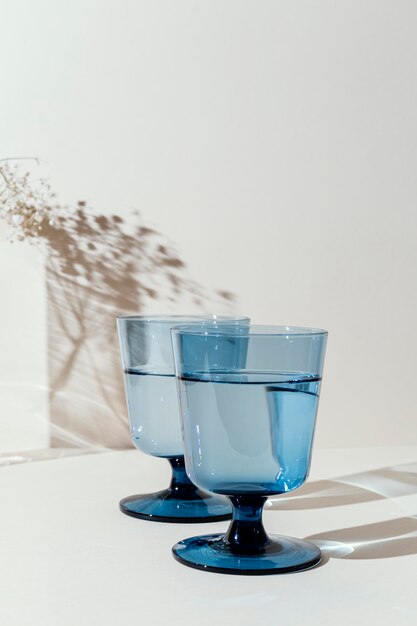 Glasses with water on table