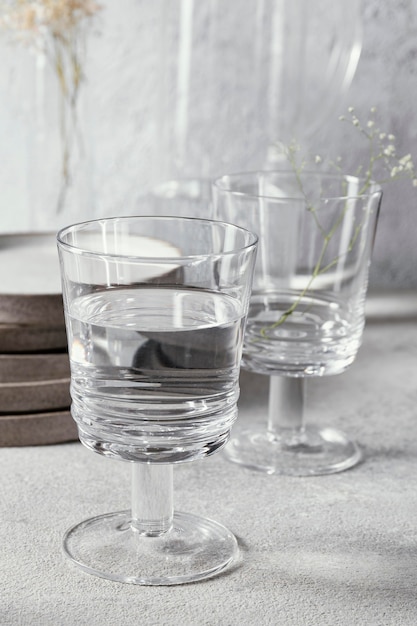 Glasses with water on table