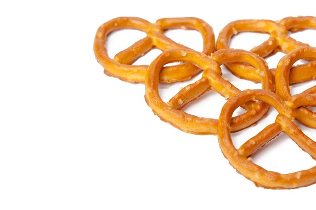 Glazed and salted pretzels isolated on white background