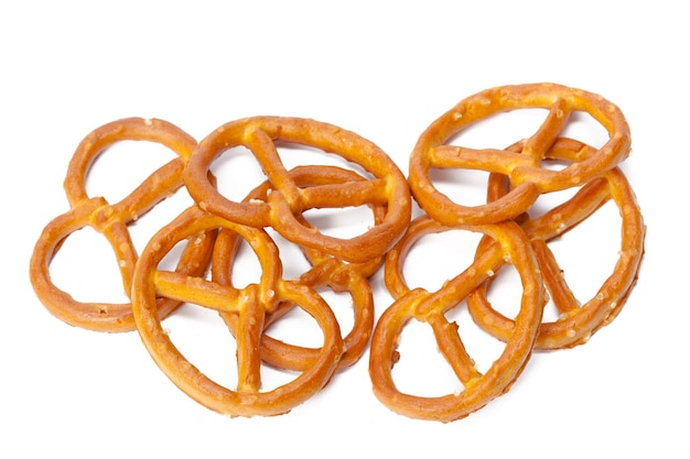 Glazed and salted pretzels isolated on white background