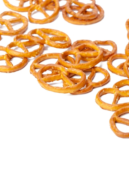 Glazed and salted pretzels isolated on white background