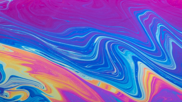 Gleaming wavy blue and purple abstract background