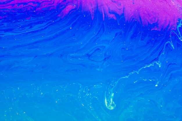 Блестящий волнистый синий и фиолетовый абстрактный фон