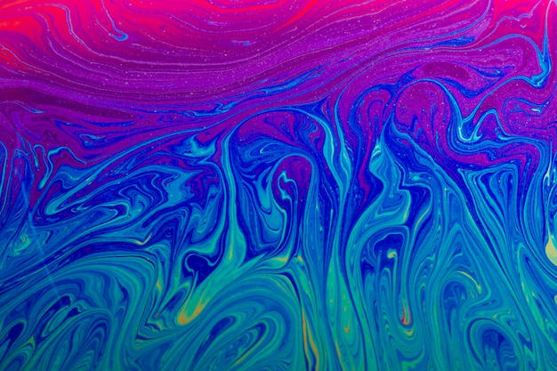 Gleaming wavy blue purple and pink abstract background