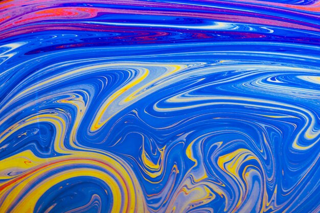 Gleaming wavy blue yellow and pink abstract background