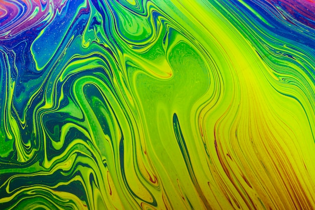 Free photo gleaming wavy green and blue abstract background