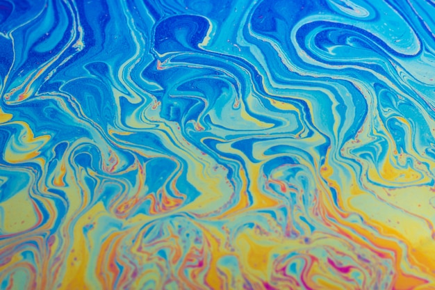 Glimmering wavy blue and yellow abstract background