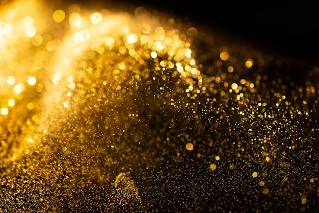 Глянцевые огни гранж фон, золото блеск расфокусированным абстрактные twinkly фона фона.