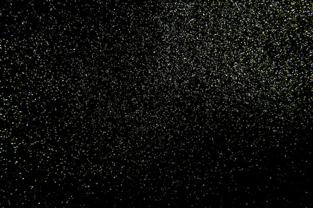星のある夜空に似たマイクロレリーフとキラキラの黒いテクスチャ プレミアム写真