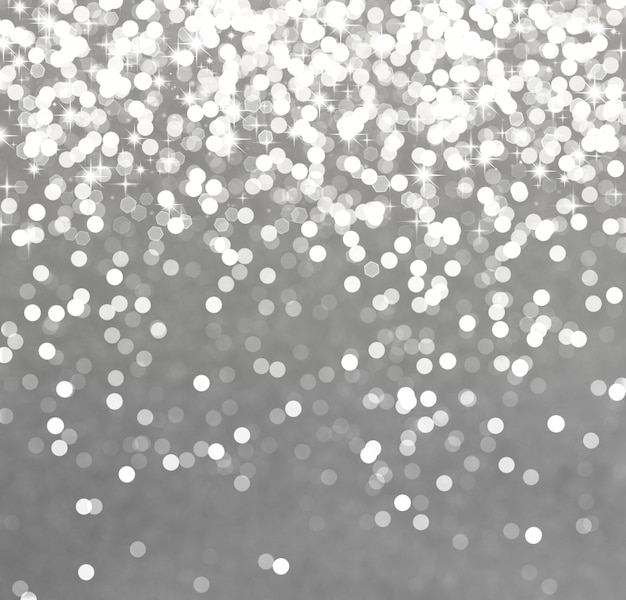 Glittery silver christmas background with stars and bokeh lights