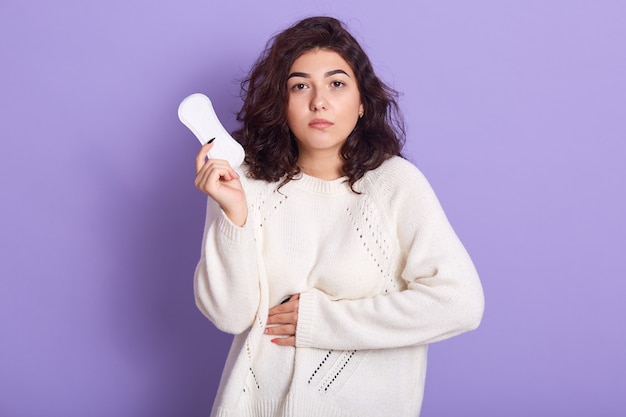 Gloomy Caucasian woman cares about personal hygiene