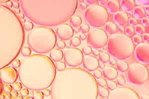 Free photo glowing pink oily bubbles