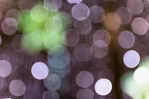 Free photo glowing shiny bokeh background