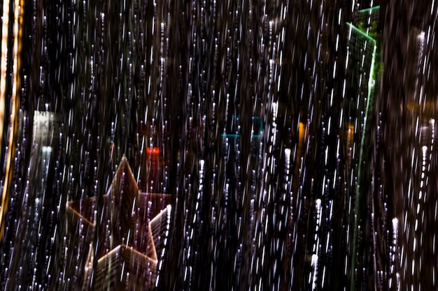 Glowing star decoration with an illuminated light streak on dark backdrop