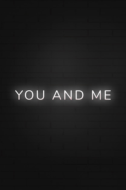 Glowing you and me neon typography on a black background