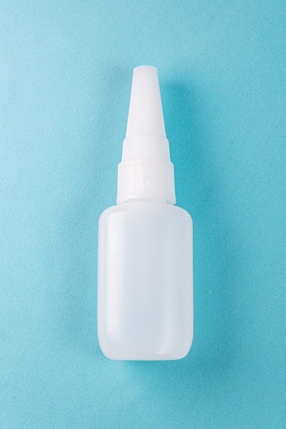 Glue bottle on the colorful background