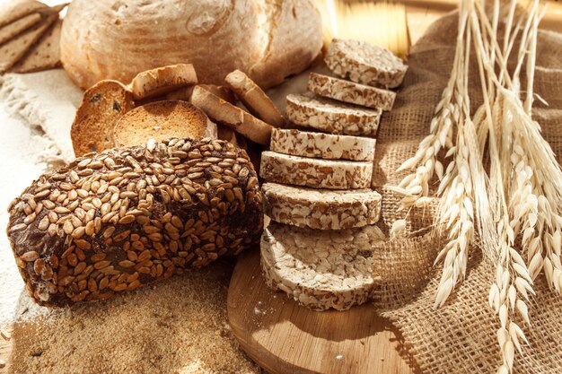 Gluten free food. Various pasta, bread and snacks on wooden background from top view