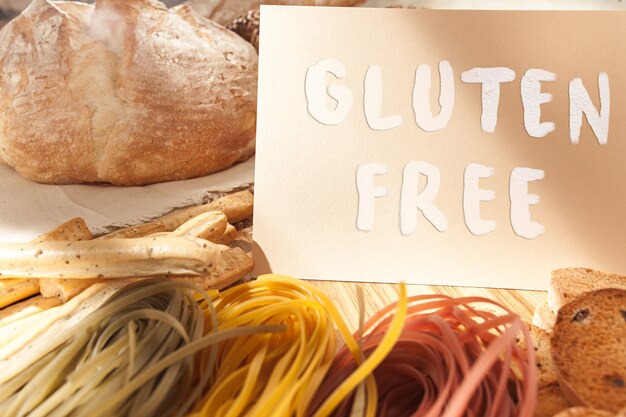 Gluten free food. Various pasta, bread and snacks on wooden