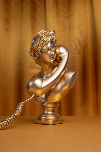Gold aesthetic wallpaper with statue