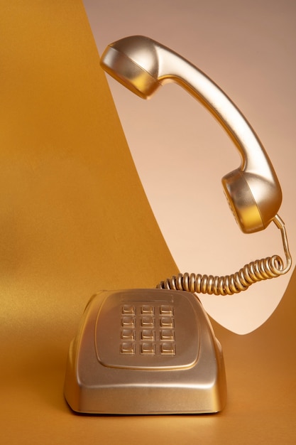 Free photo gold aesthetic wallpaper with telephone