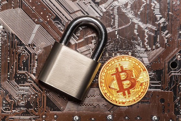 Free photo gold bitcoin and padlock