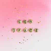 Free photo gold congrats beads text typography on pink