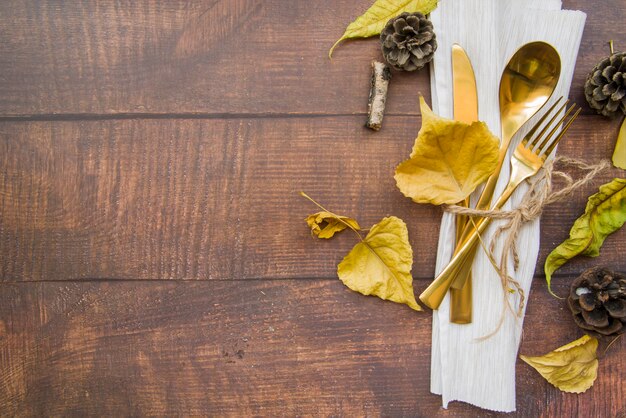 Gold cutlery set on white napkin