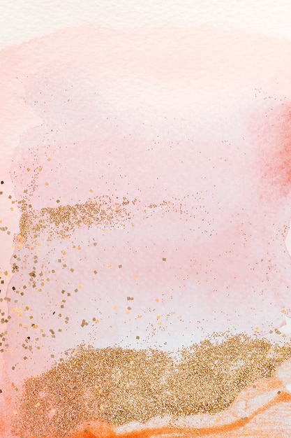 Gold glitter on pink watercolor background