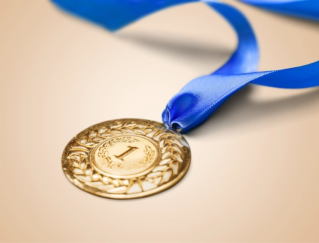 Gold medal with  ribbon  on  background