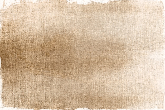 Free photo gold painted on a fabric textured background