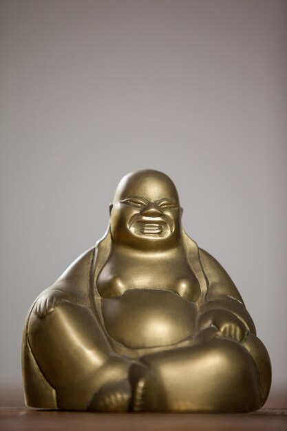gold painted laughing buddha figurine