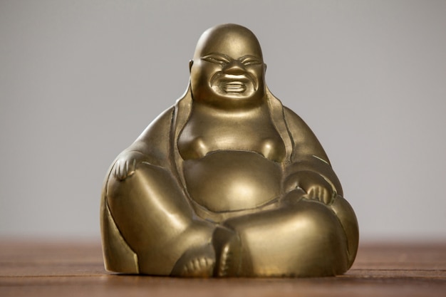 Gold painted laughing buddha figurine