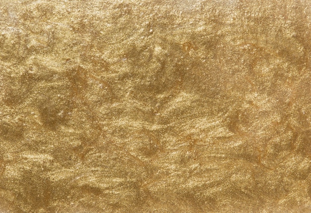 Золотой окрашенный текстурированный фон стены