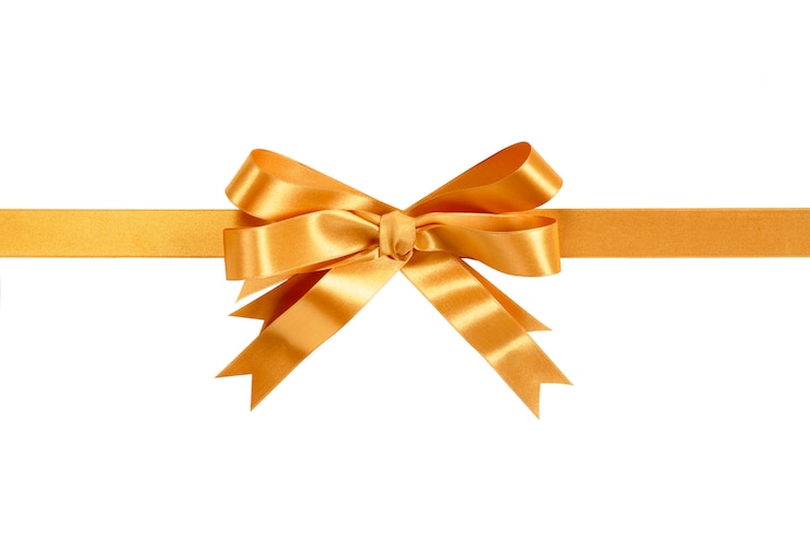 Free Photo gold ribbon and bow isolated against white.