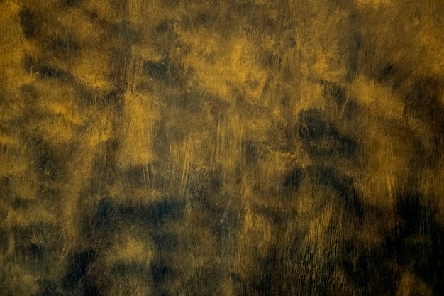 Gold texture. hand drawn brush stroke on black.