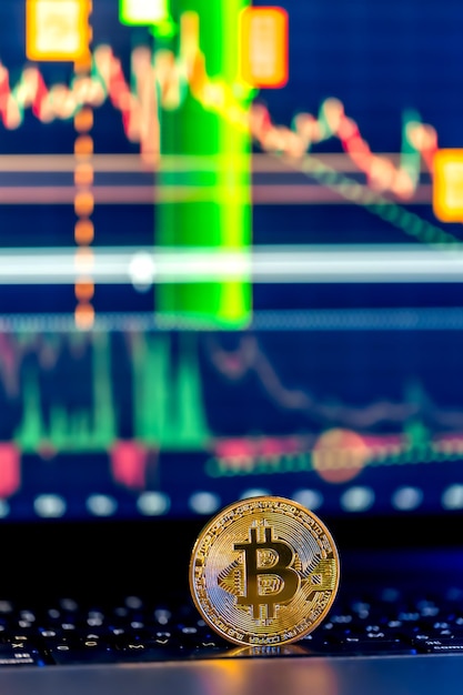 Free Photo golden bitcoin coin on keyboard stock market trading chart online candlestick