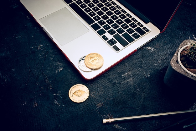 Free photo the golden bitcoin on keyboard