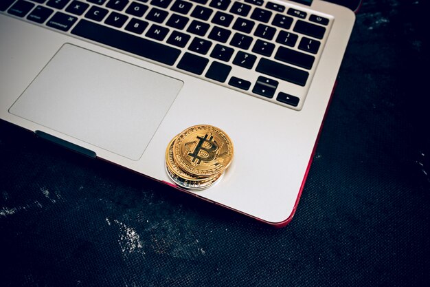 The golden bitcoin on keyboard